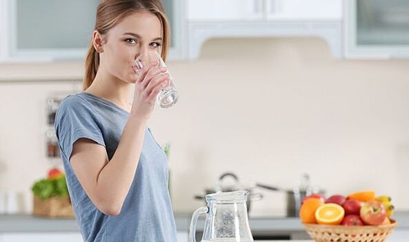 A girl is trying to lose weight by following a water diet