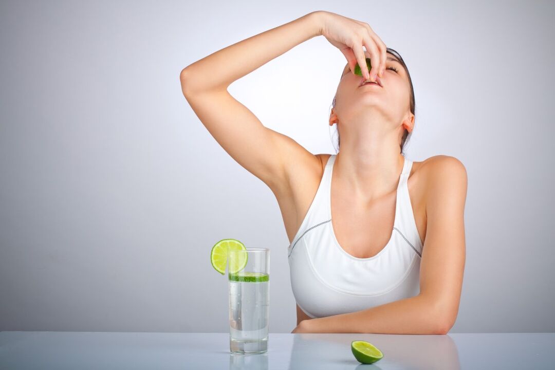 girl drinks water with lemon for weight loss